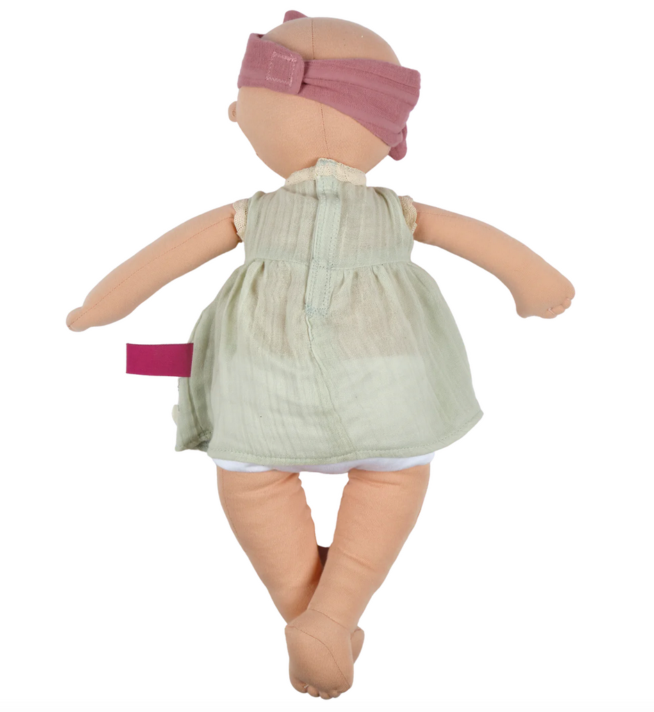 View of the back of the the Baby Kaia soft doll.