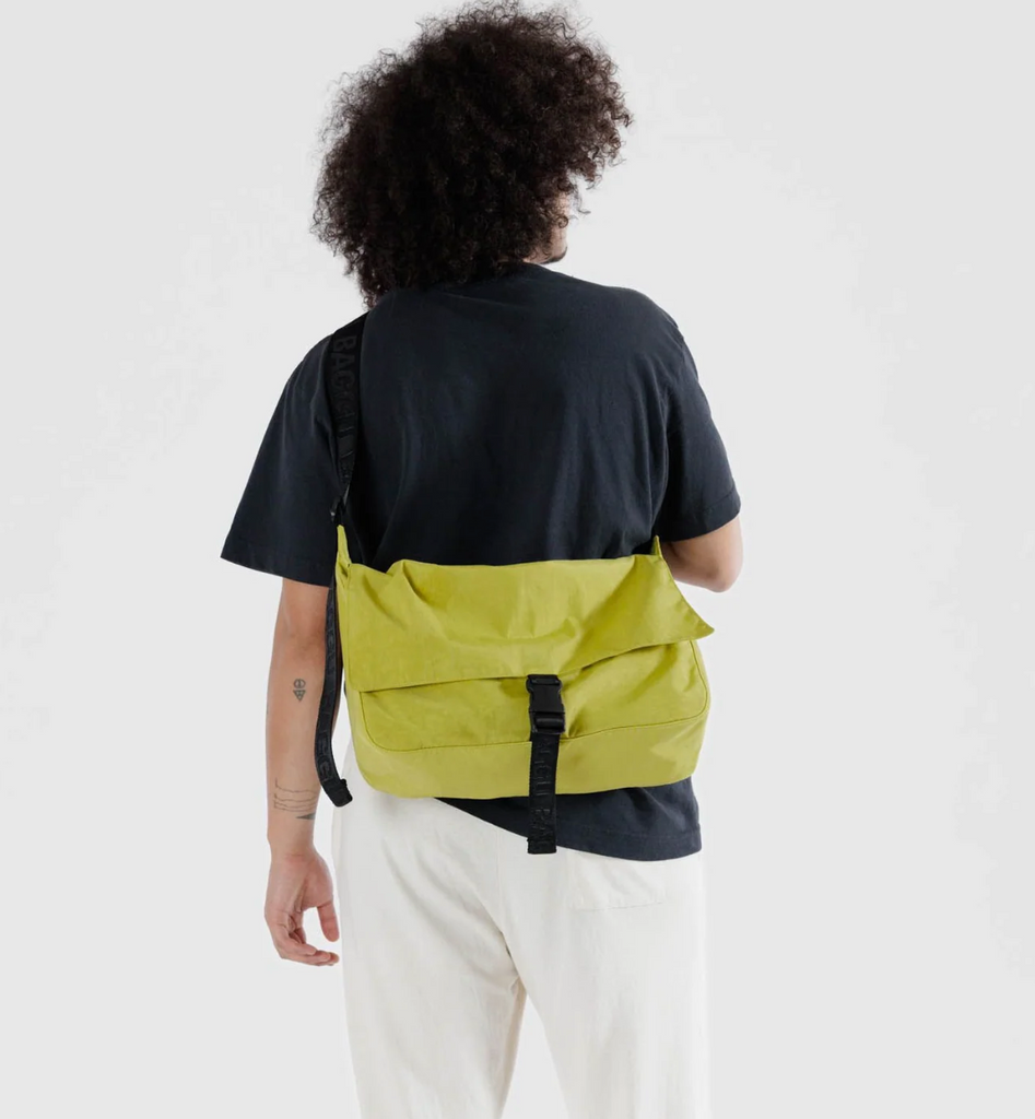 Baggu Lemongrass Messenger Bag being worn as a cross body bag.