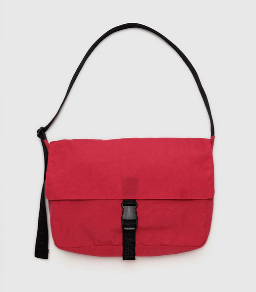 Candy Apple red nylon messenger bag wuth black strap and closure.