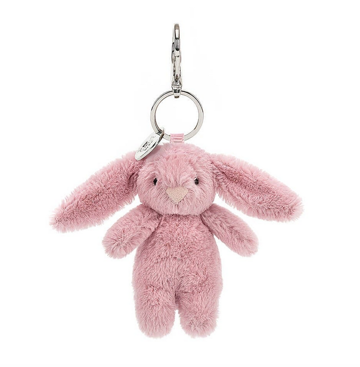 Plush tulip colored bunny with a silver lobster claw bag charm.