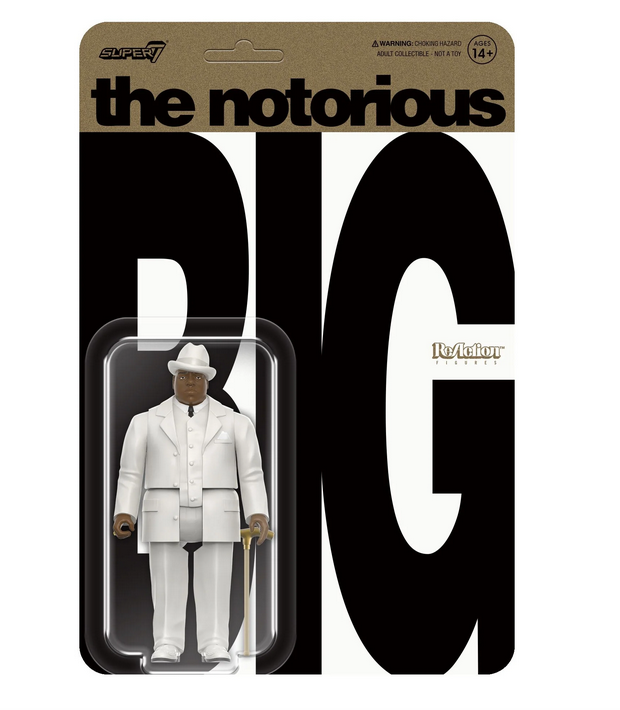 Biggie action figure packaged in clear plastic on a backing card with gold top panel that read the notorious and big block letters in black that spell BIG