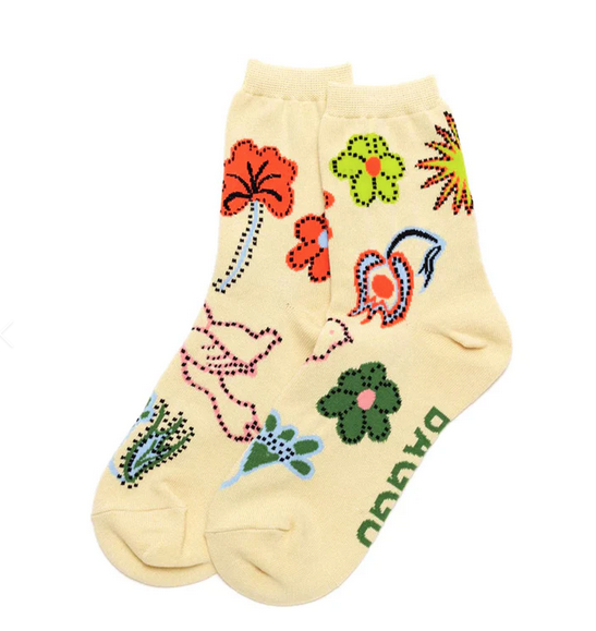 A pair of cream colored crew socks with embroidered designs of flowers and birds all over them.
