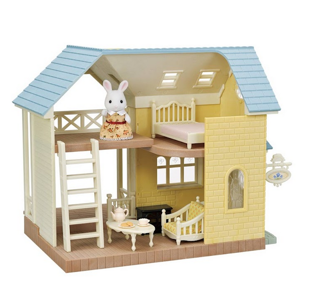  This cute cottage features two floors, under a pale blue roof. One side is open for ease of play within the space.