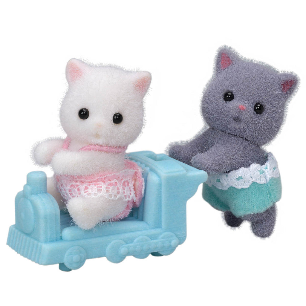 Calico Critters Persian Cat Twins one white and one grey riding on the train ride on toy.
