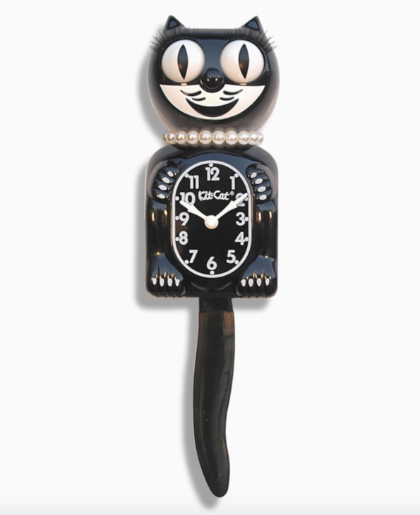 Lady Kit Cat clock with moving eyes and tail in classic black with eyelashes and pearls. 
