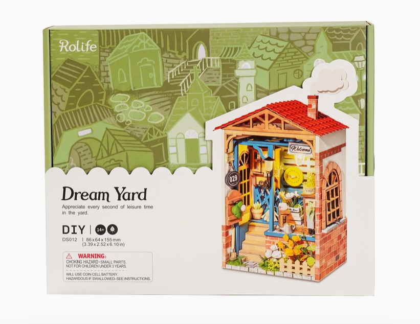 The box containing the pieces for the Dream Yard Miniature House Kit. 
