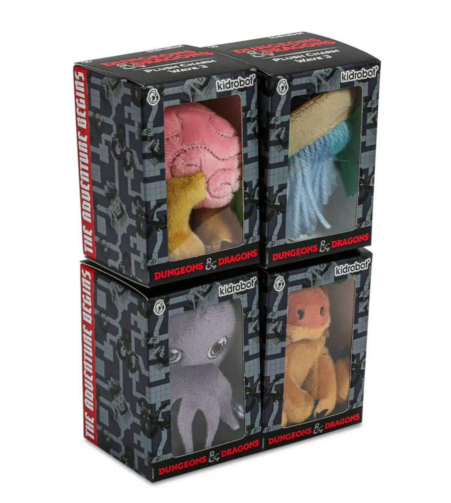 4 Individual boxes with clear window showing which D&D plush charm is inside the box.