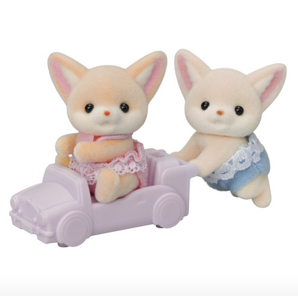 Calico Critters Fennec Fox Twins. One is riding in a toy car and the other is pushing it. 