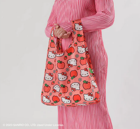 The Standard Baggu bag in Hello Kitty Apple print in use. 