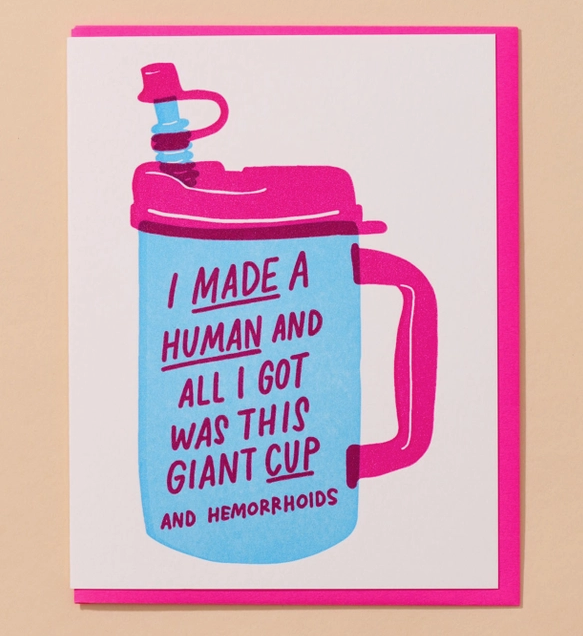 Card features a hospital water cup and reads "I made a human and all I got was this giant cup (and hemorrhoids)" 