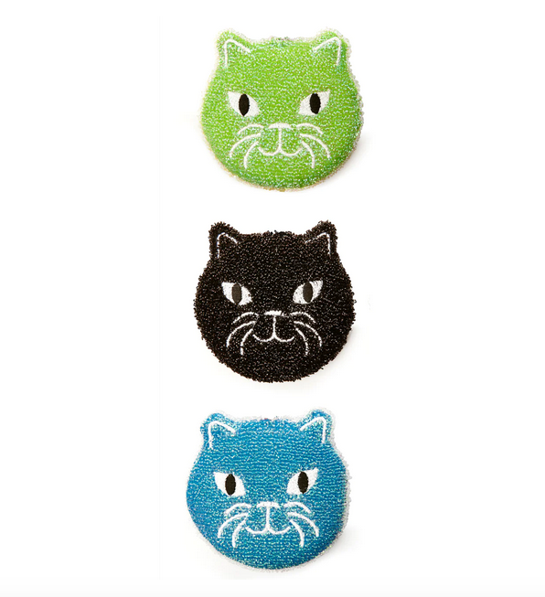 The green, black and blue kitty scrubbers out of the package. 