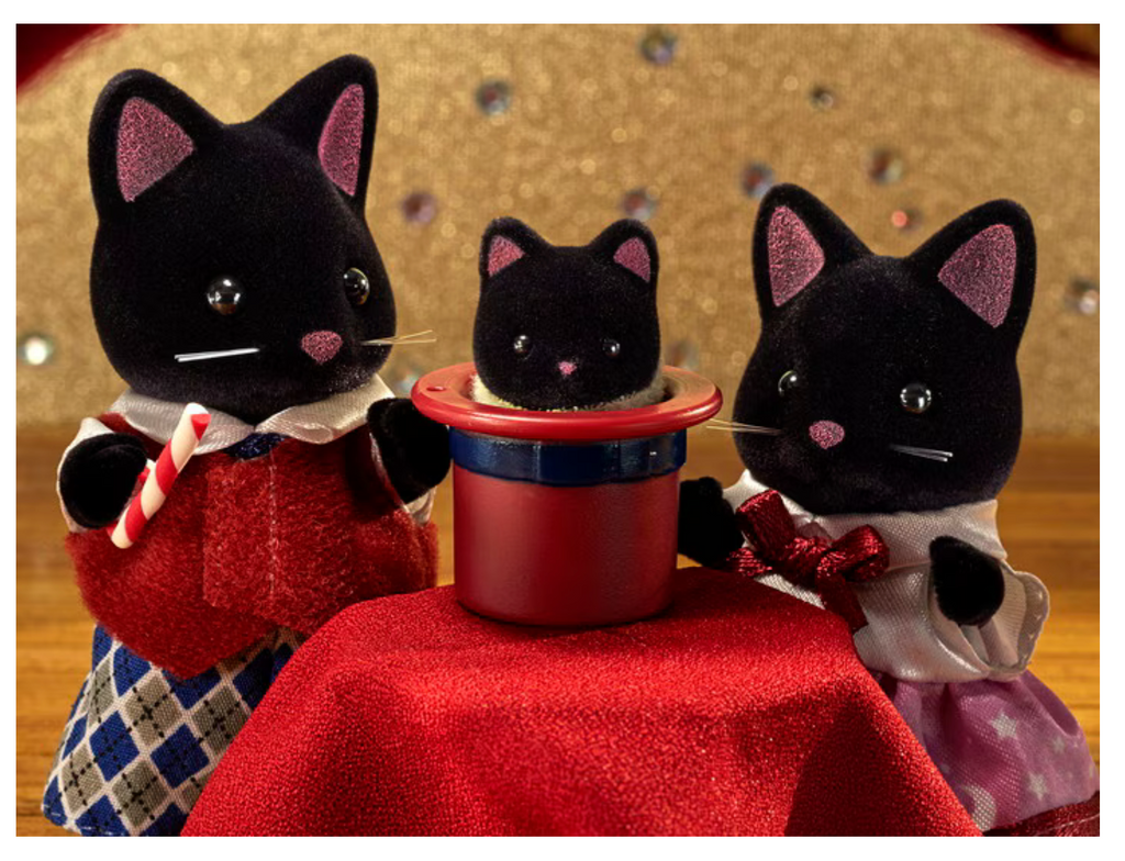 Calico Critters Midnight Cat Family figures putting on a magic show.
