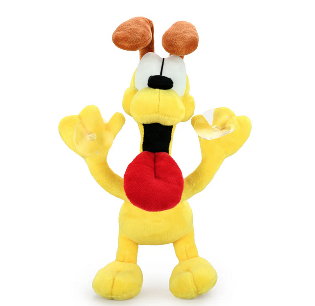 Yellow plush dog with big red wagging tongue who has suction cups on all four paws.
