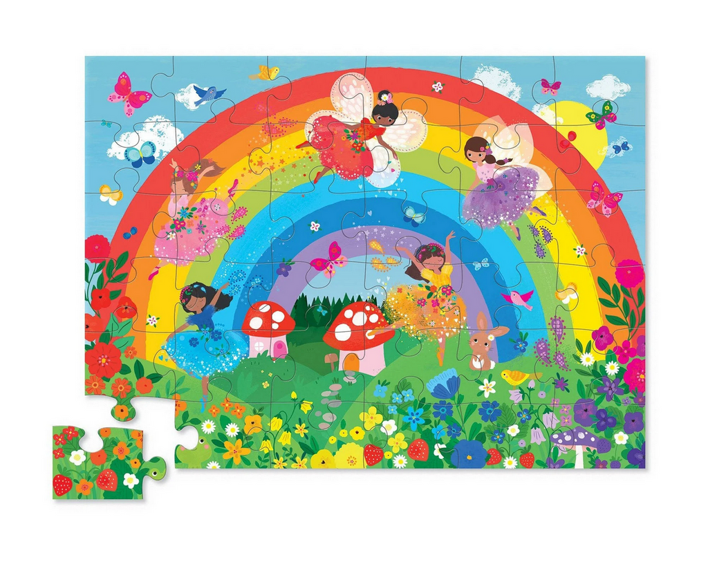 36 piece Over the Rainbow puzzle featuring illustration of a rainbow with colorful fairies flying around.