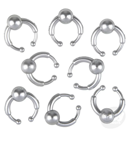 Close up of fake piercing jewelry that comes in the Painless Piercing prank set. 