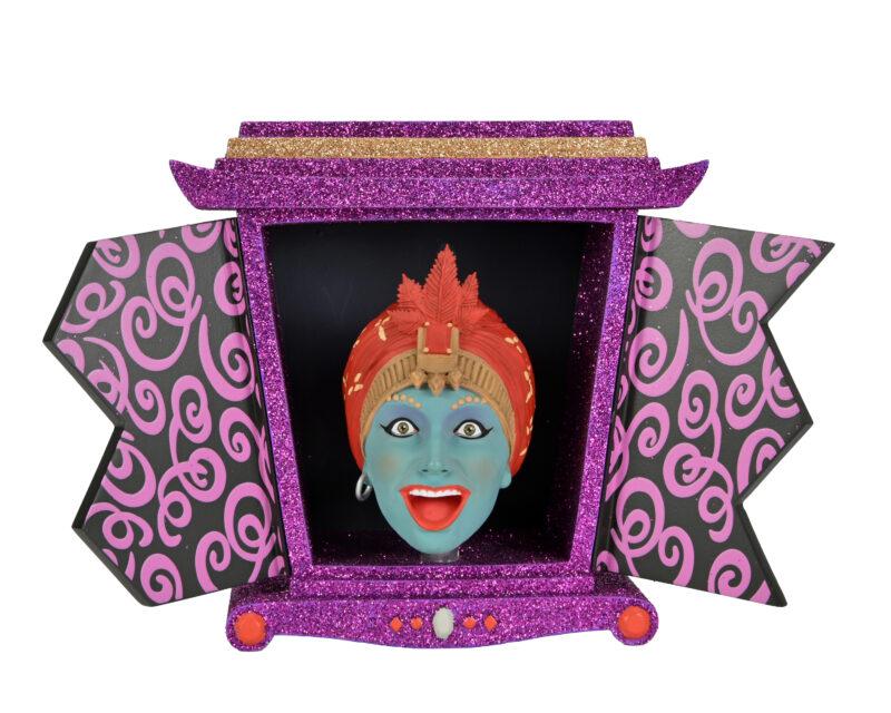 Jambi's genie box open to show Jambi's bobble head waiting to grant your wish. His box is purple glitter and the  interior of the doors are black with a purple swirl pattern.