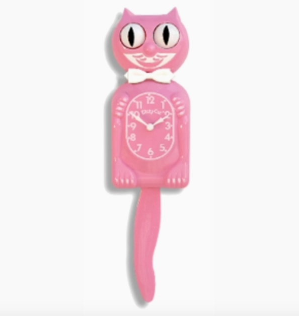 Pink satin colored Kit Cat wall clock with white bowtie, moving eyes and wagging tail. 