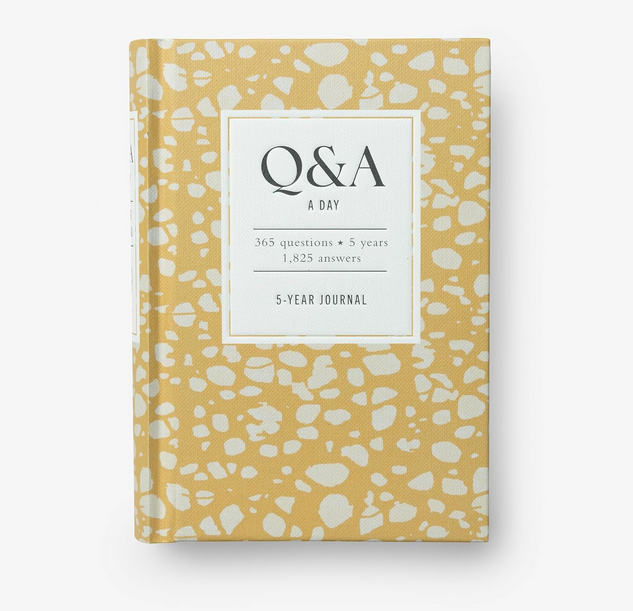 Cover of Q & A A Day Spots with a yellow background white different shaped spots all over it. 