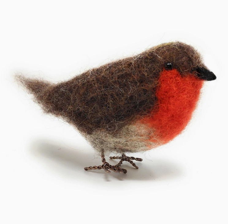Close up view of a felted Red Robinwith wire feet. 