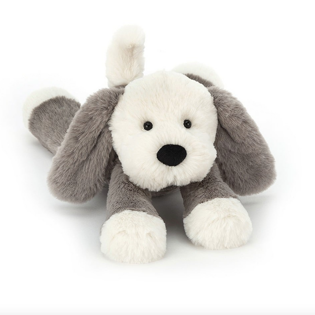 Super soft plush Smudge Puppy laying down  ready for a nap.