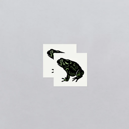 Speckled foil frog temporary tattoo sheets. 