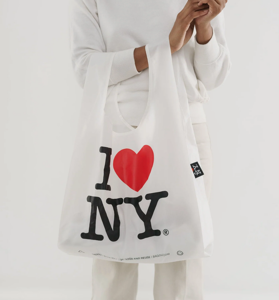 I Love NY Baggu standard bag full of stuff and carried on an arm.