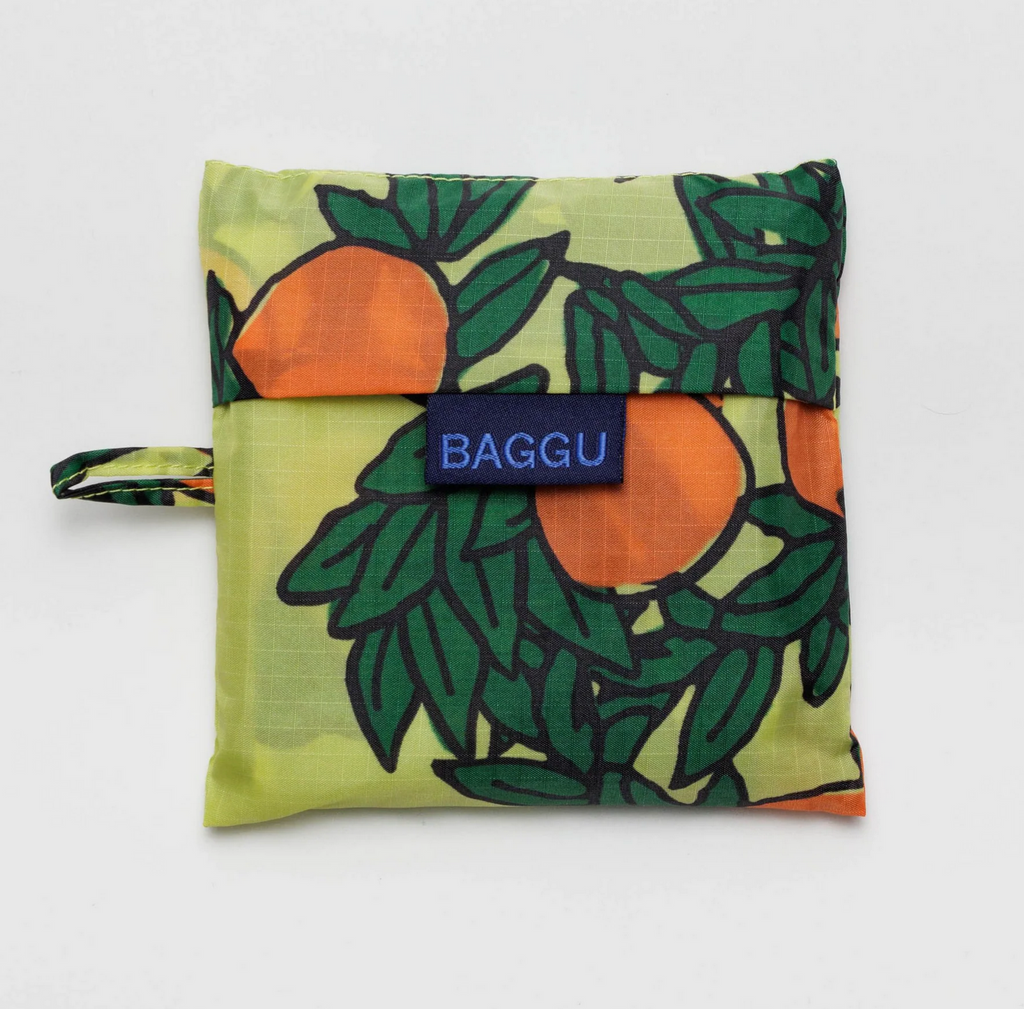 Orange Tree Yellow Standard Baggu folded in it's matching pouch.