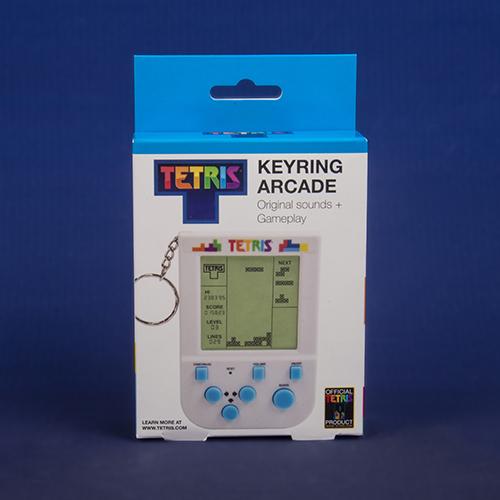 White box with bright blue hang tab that has a picture of the Tetris mini Arcade keyring on the front.