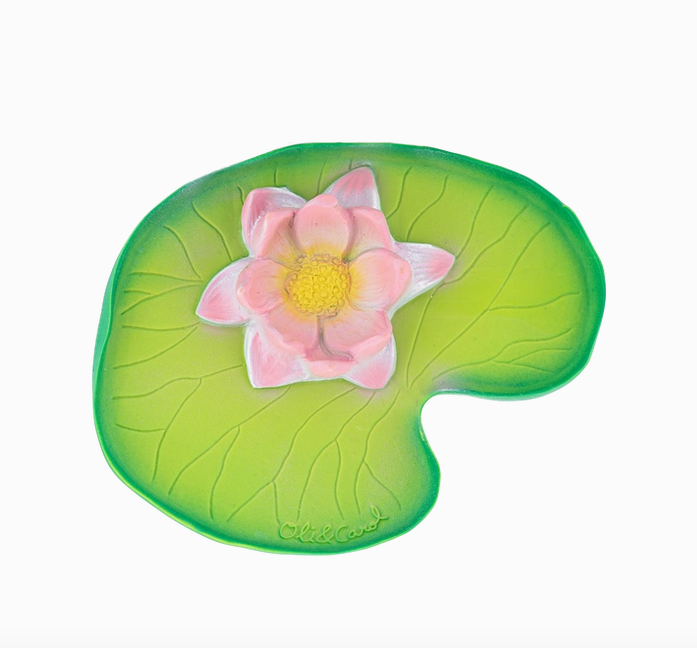Close up view of the Water Lily teether toy. A flat green lily pad with a pink flower sitting on top. 