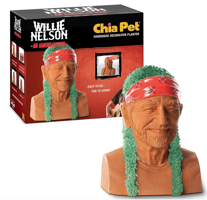 Willie Nelson ceramic planter with full growth of his braids and hair with the box in the background. 