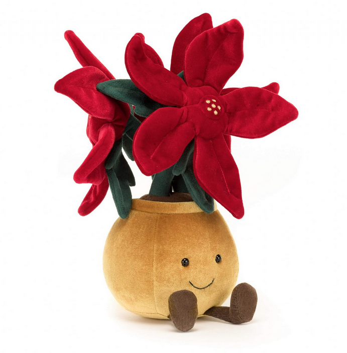 Amuseable Red Poinsettia in a rounded gold velour pot filled with fluffy soil with red suedette petals stitched with gold freckles, and deep green leaves and sturdy stalks.