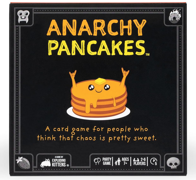 Game box for Anarchy Pancakes. The box is black with an illustrated stack of pancakes with a smiling face and it's arms up in the air, dripping with butter. Anarchy Pancakes is is written in gold and yellow letters. 