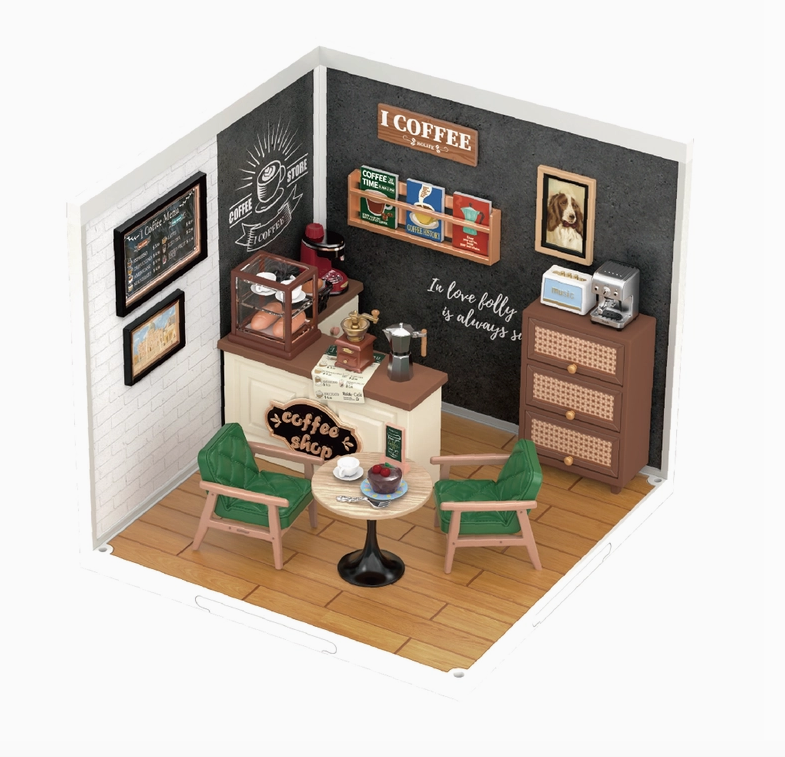 Close up view of the Breezy Time Cafe model fully assembled with it's cafe table and chairs, counter with a pastry case and coffee themed art on the walls, 