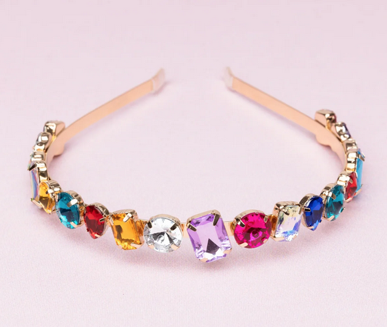 Children's goldtone headband with large, multi-colored gems. Gem assortment includes rubies, sapphires, diamonds, citrine, and ameythsts.  Settings for the gems are pear cut, princess, cabuchon, square cut and rectangle. 