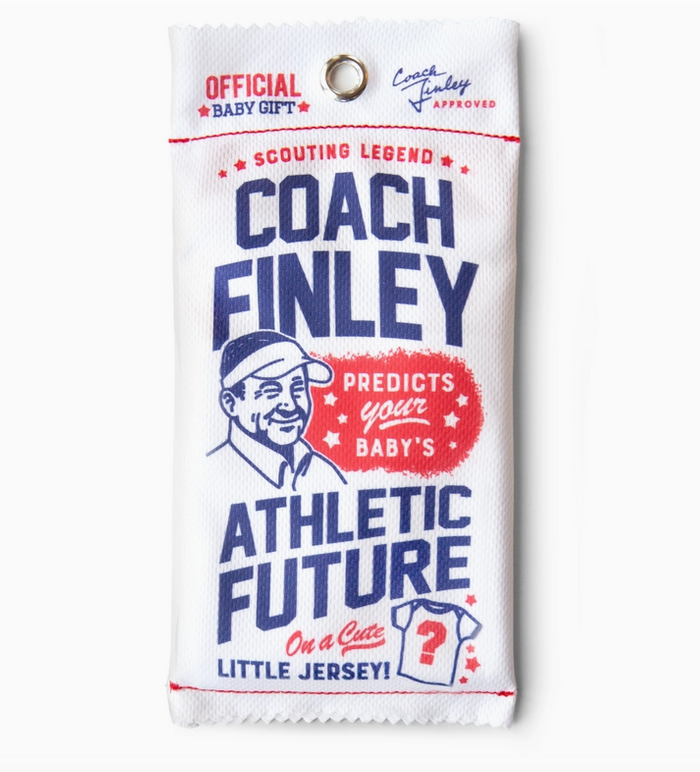 White mesh sports bag sealed at the top and bottom with blue lettering. Pouch reads " Scouting Legend, Coach Finley Predicts your Baby's Athletic Future on a Cute Little Jersey! 