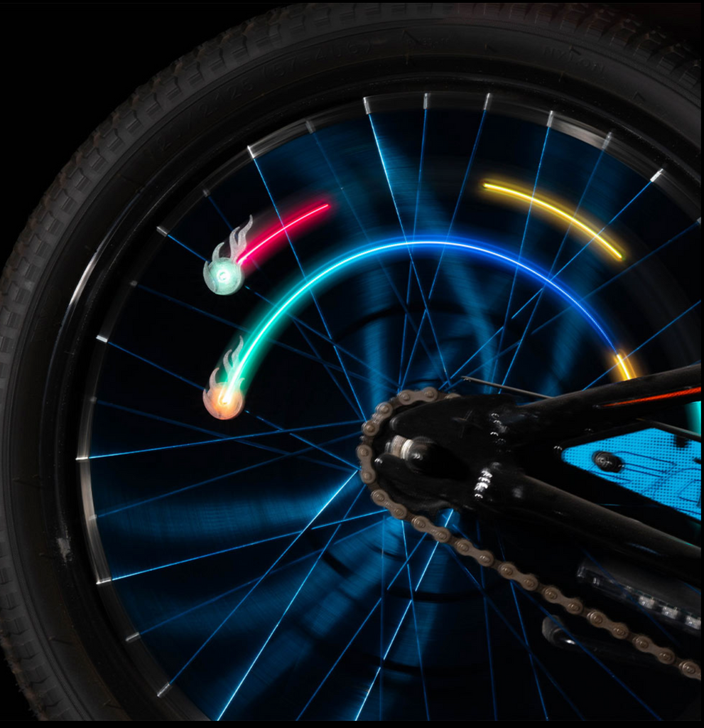 CometBrightz bike spoke lights on a bike wheel in motion.