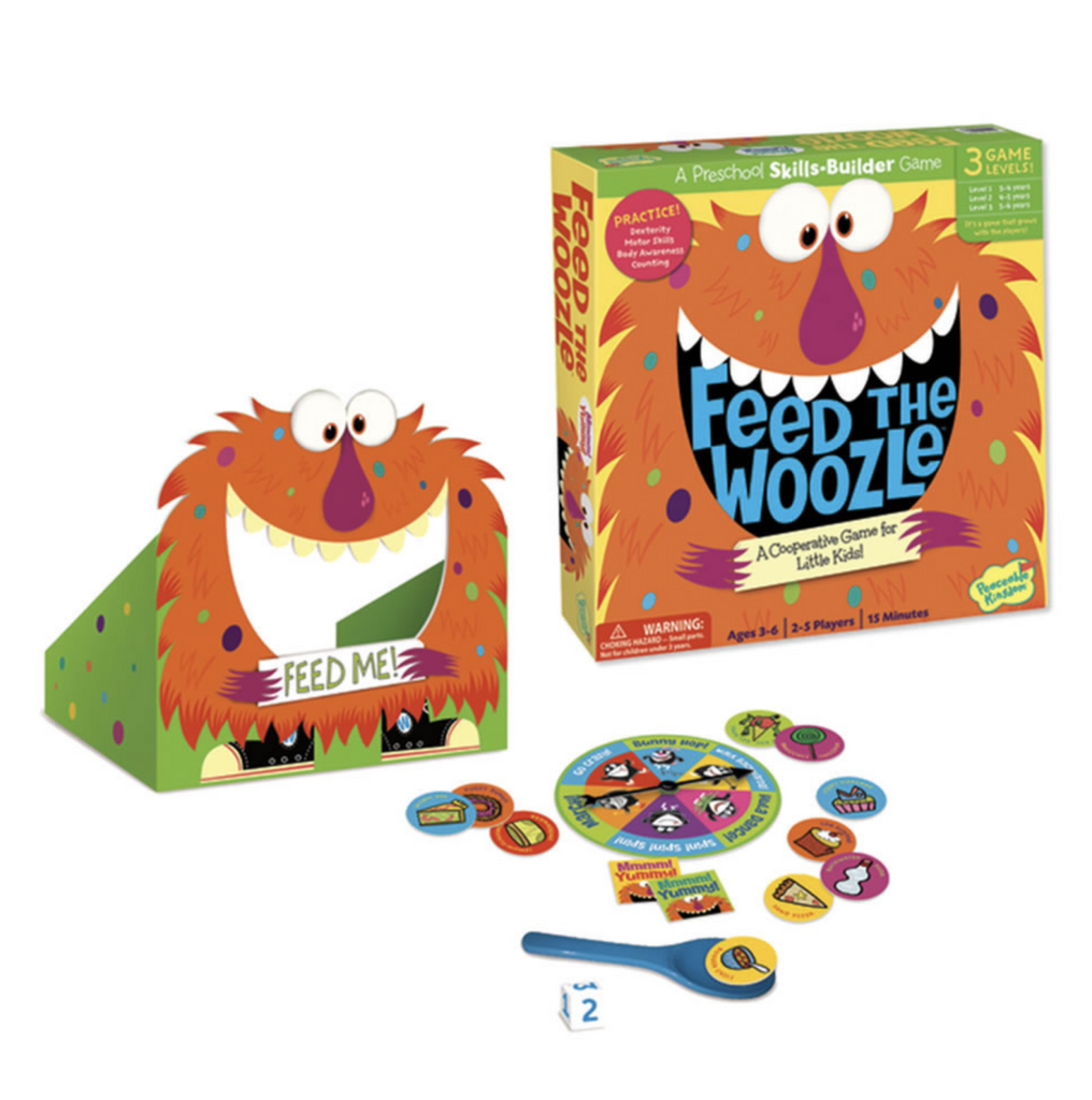 Feed The Woozle game box and game pieces. A stand up hairy, orange monster with it's mout open and sign reading "Feed Me". The game spinner, tokens and launching paddles. 