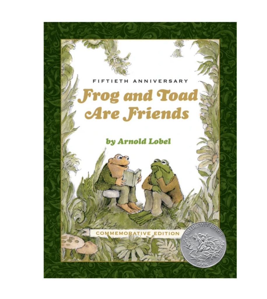 Cover of 50th anniversary edition of "Frog and Toad are Friends" by Arnold Lobel. A Caldecott Honor Book. Cover is a drawing of toad sitting on a mushroom reading a book to frog, seated on the ground.