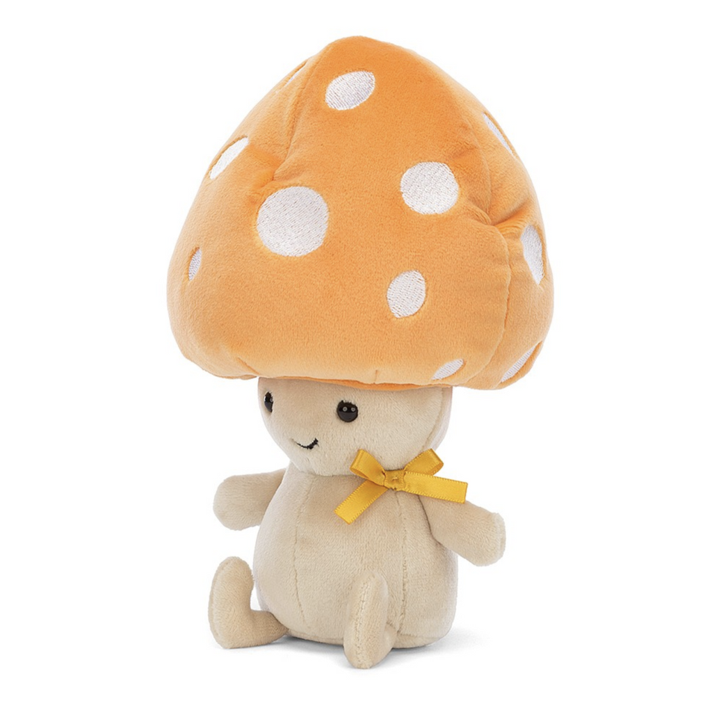 Fun Guy Ozzie mushroom plush sitting up with a grin and tangerine bow around his neck. 