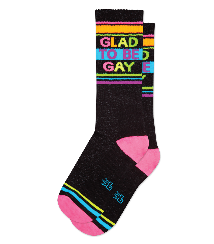These super-comfy, unisex, one-size-fits-most, Glad To Be Gay Gym Socks are made in the USA of Black Cotton with accents of Bobby Pink Nylon, Neon Orange Nylon, Libby Yellow Nylon, Scuba Blue Nylon, Libby Berry Nylon. Machine wash cold, line dry. 61% Cotton, 36% Nylon, 3% Spandex.  
