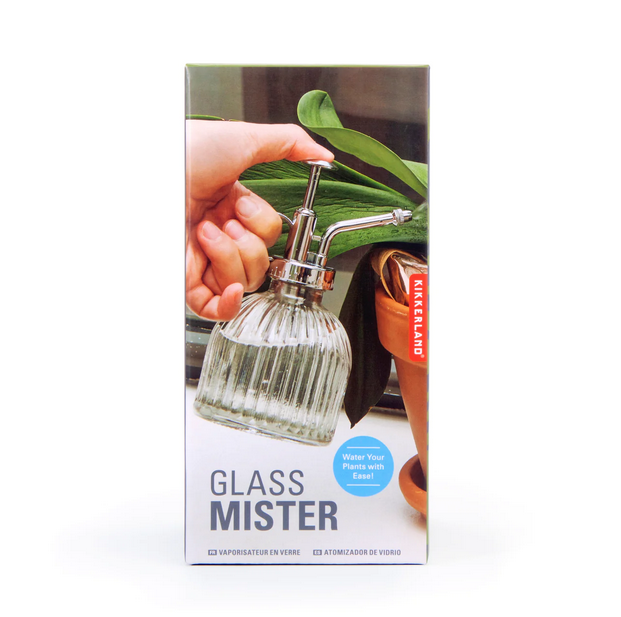 Box with a picture of the glass mister in use spraying the leaves of a plant. 