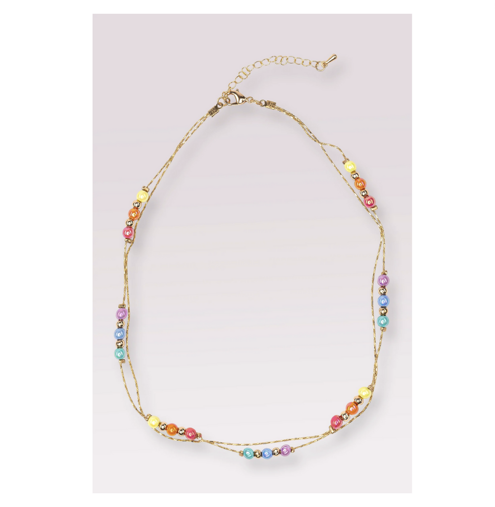 Dainty gold chain and shiny pastel bead necklace.