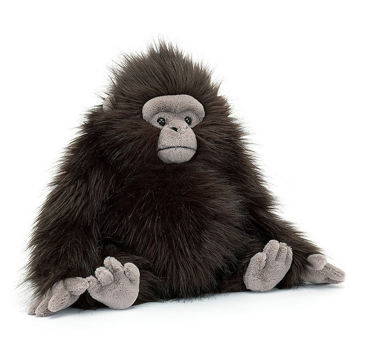 Gomez Gorilla plush sitting upright and facing forward with his grey face and silky, long, black fur. 
