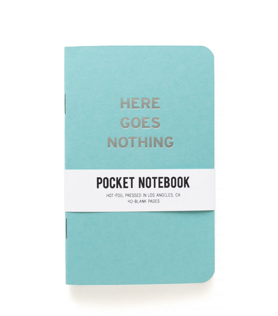 Aqua pocket notebook reads Here Goes Nothing in silver.