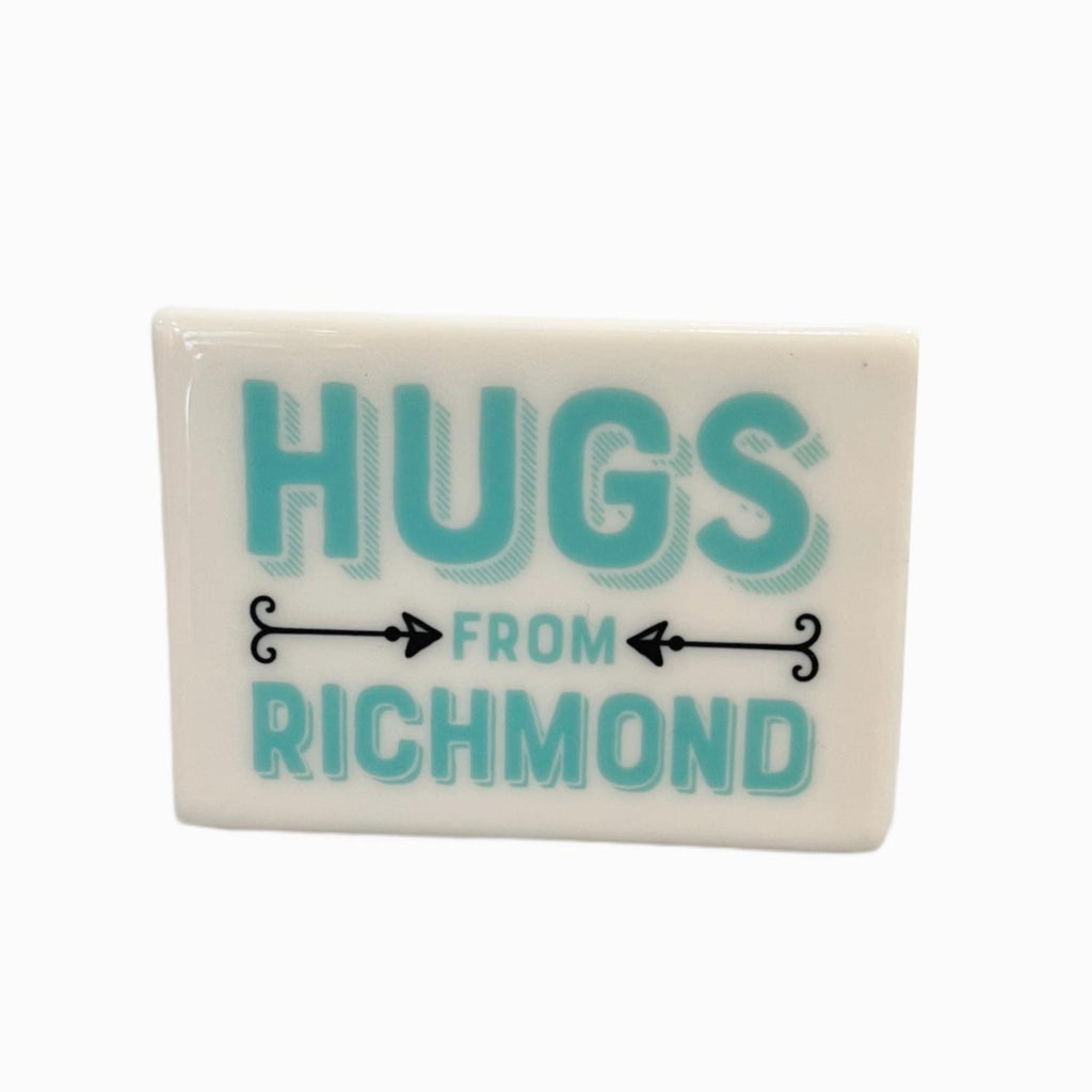 White rectangle tile magnet with "Hus from Richmond" in aquamarine letters. 