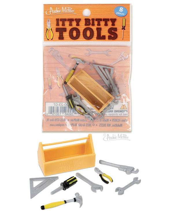 Set of tiny tools with a toolbox in clear plastic bag. And all set out in front of the bag. 
