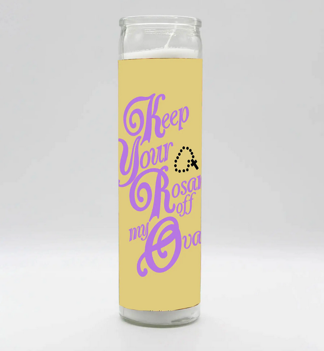 Glass prayer candle that reads Kepp your rosaried off my ovaries.