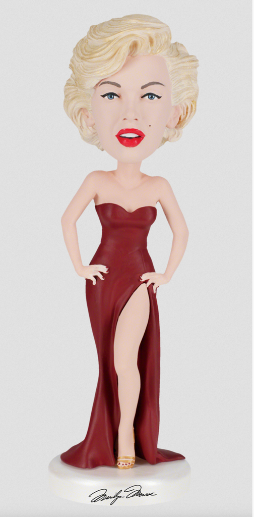 Bobblehead of actress Marilyn Monroe in a red strapless dress.
