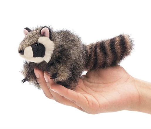 The stripy-tailed, masked Raccoon finger puppet is perched on hand. 