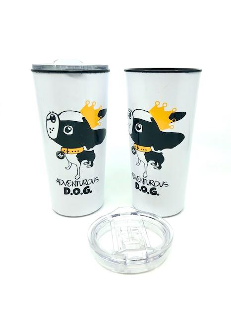 Boston Terrier Mirabelle on a white travel tumbler. Mirabelle is wearing a yellow collar and crown. Text underneath reads "Adventurous D.O.G."
